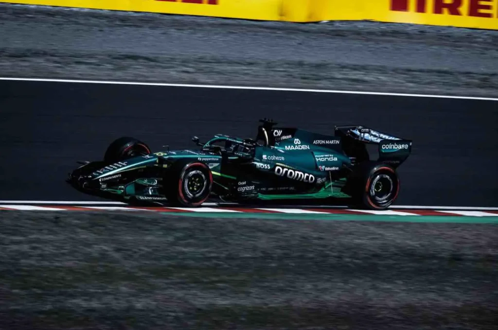 The Aston Martin F1 car featuring Crypto.com and Coinbase branding, highlighting the major exchange partnerships within the 2026 Formula 1 season.