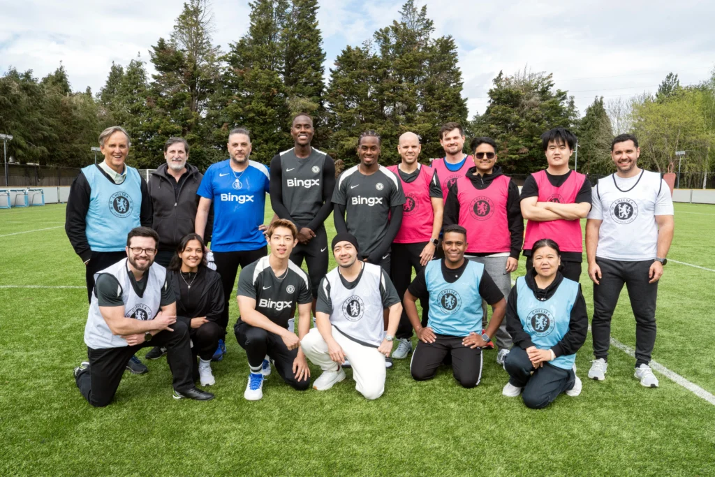BingX VIP group photo on Cobham training pitch with Chelsea players 