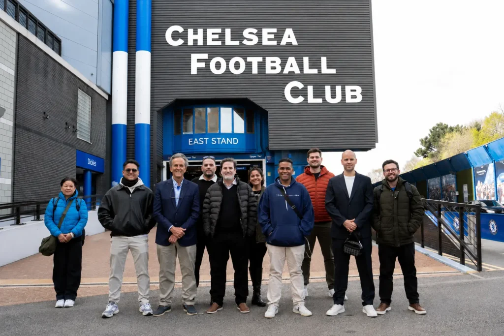 BingX VIP experience — group photo outside Chelsea FC Stamford Bridge East Stand
