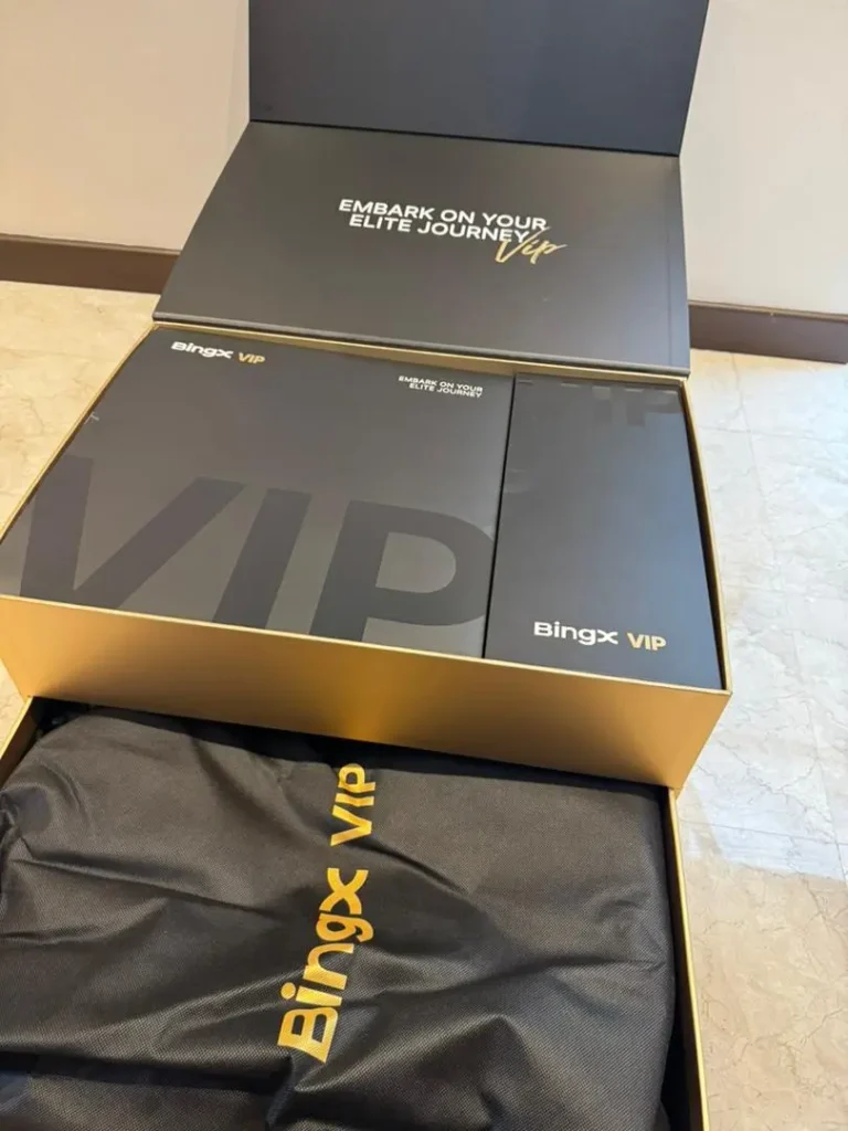 BingX VIP gift box opened showing inner contents matte black gold