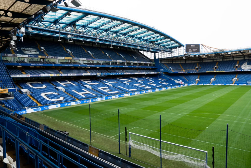 Stamford Bridge pitch view with BingX branding on perimeter boards